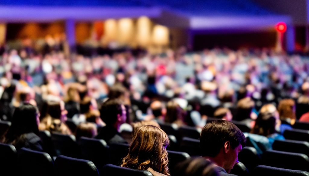 Audience gathered in a conference auditorium