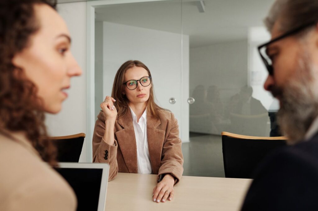 Professionals listening during a focused business discussion